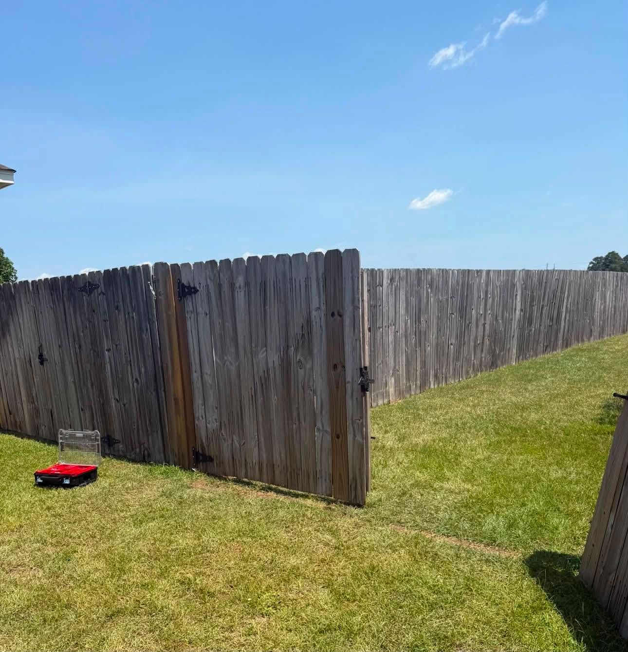 Wooden fence gate rehung and closed square after REDLINE’s repair