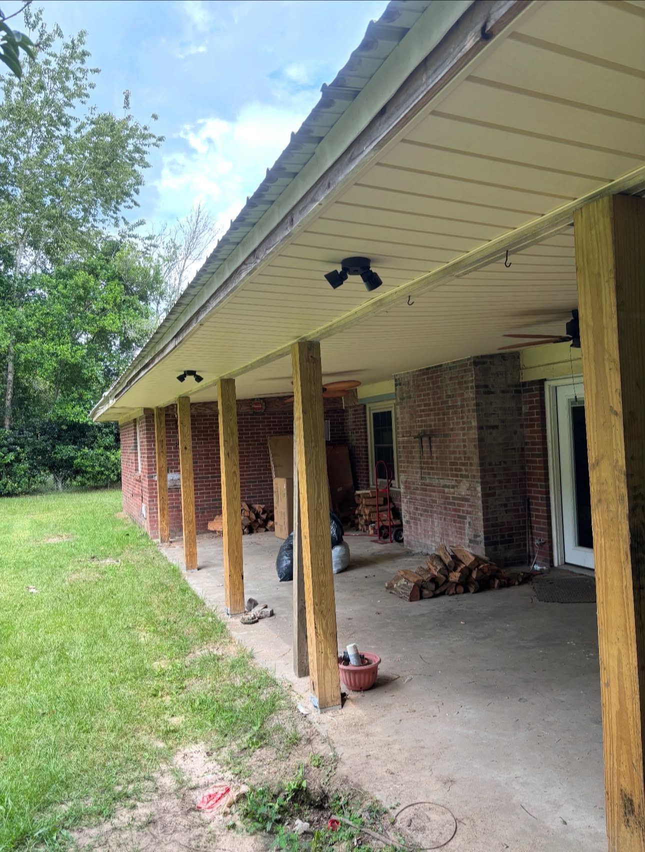 Back porch finished with white vinyl soffit by REDLINE